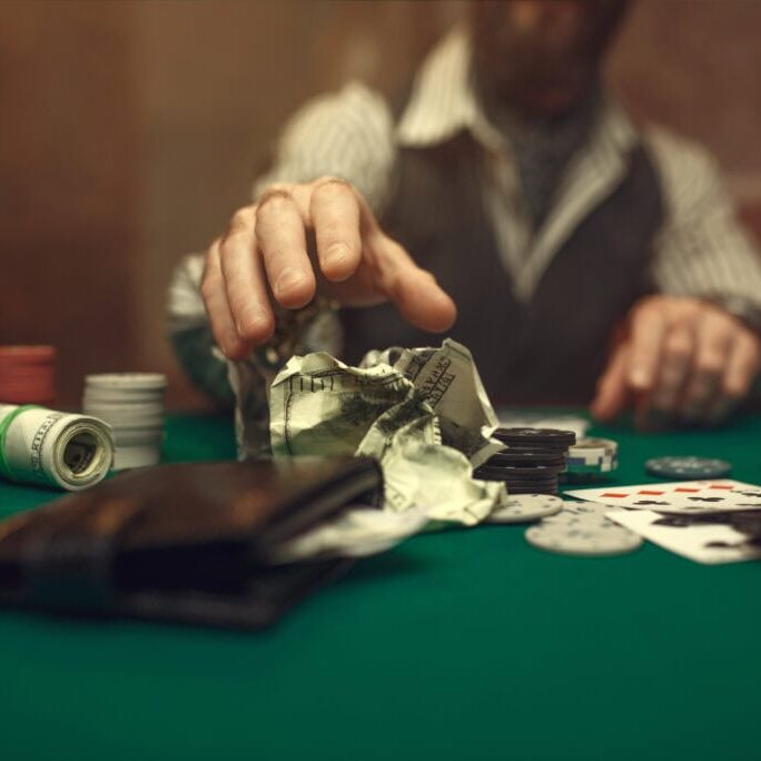 Poker player takes the bet, casino. Games of chance addiction. Man leisures in gambling house, gaming table with green cloth